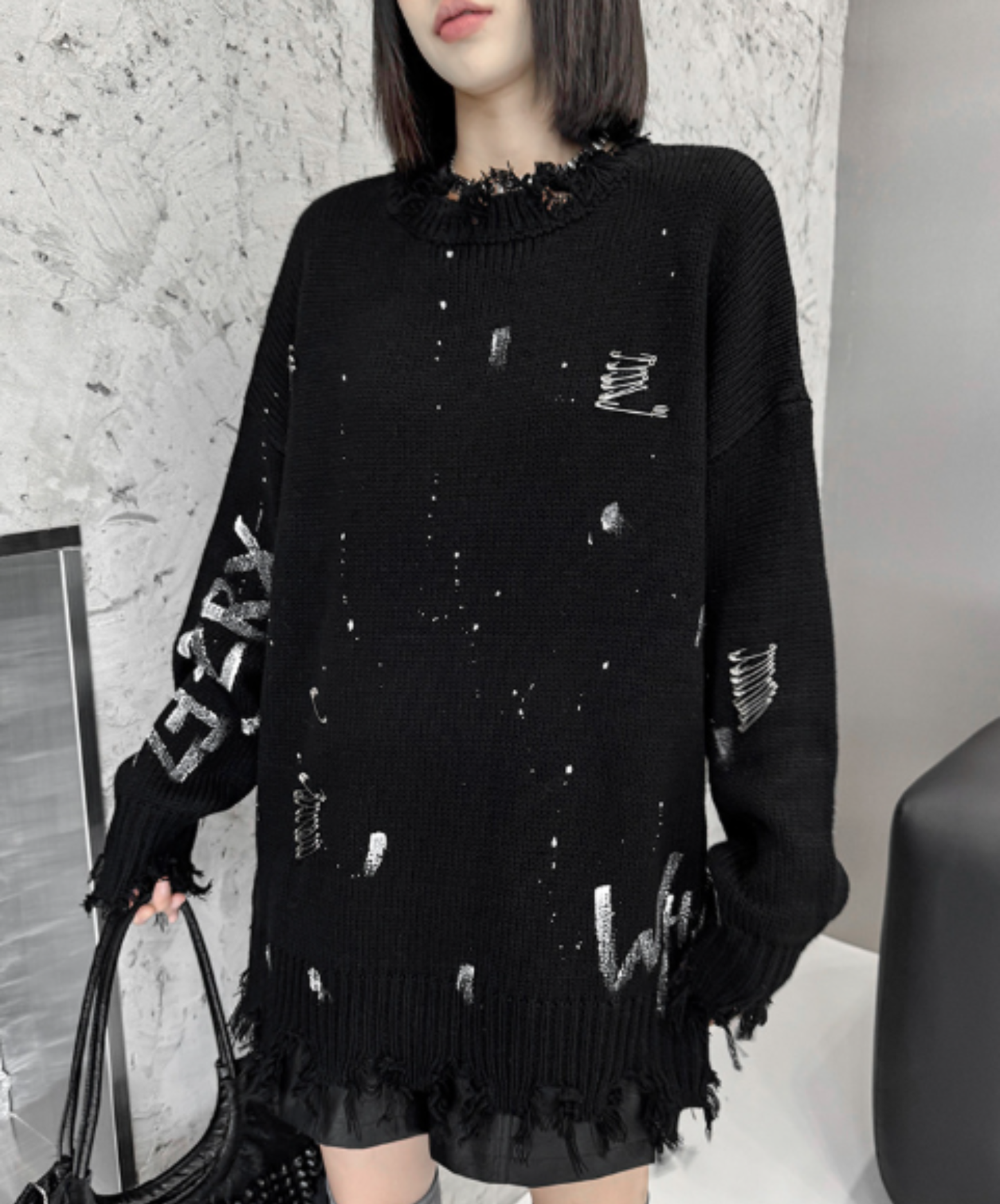 spliced design with heavy distressing sweater EN3124