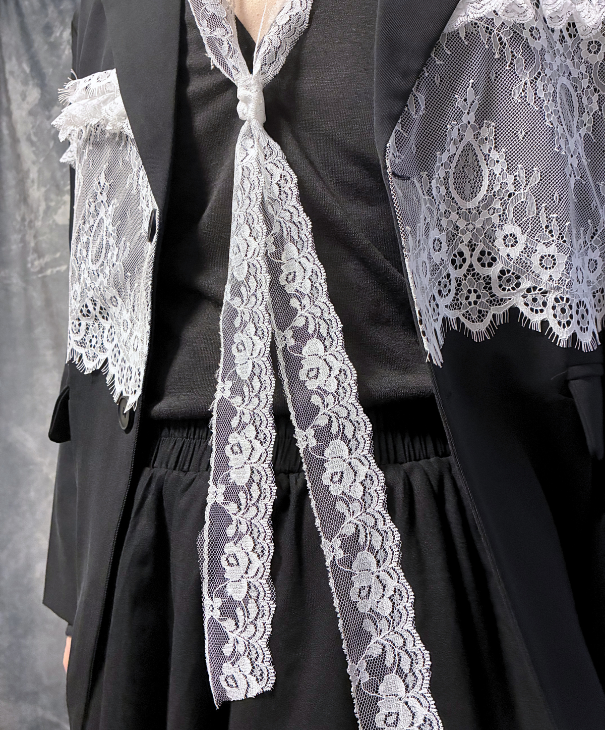panelled design with a lace bow tie jacket EN3166