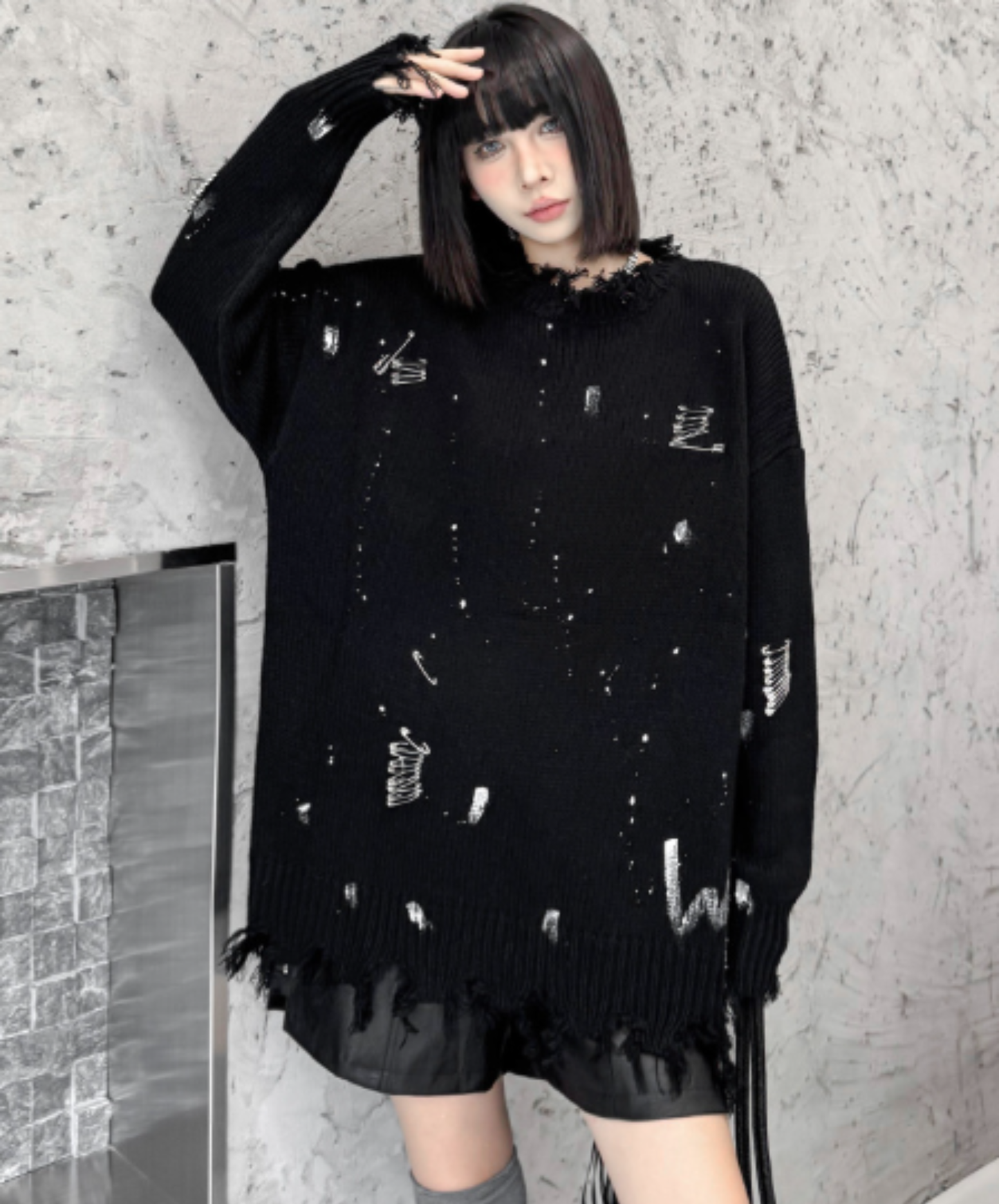 spliced design with heavy distressing sweater EN3124