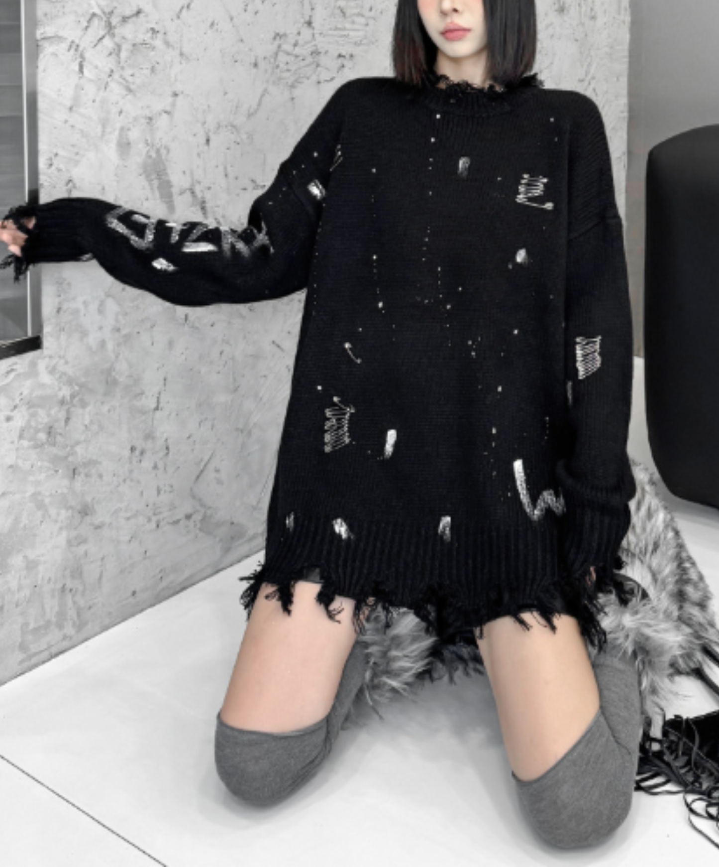 spliced design with heavy distressing sweater EN3124