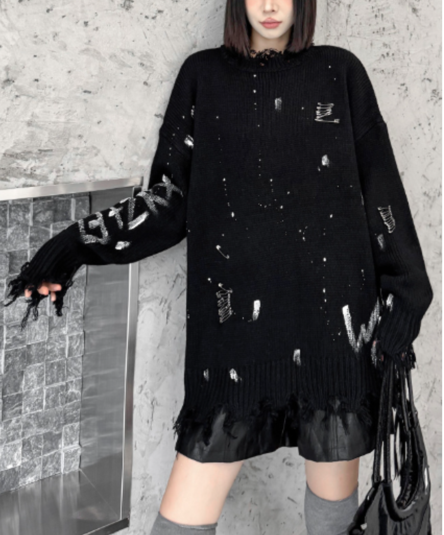 spliced design with heavy distressing sweater EN3124