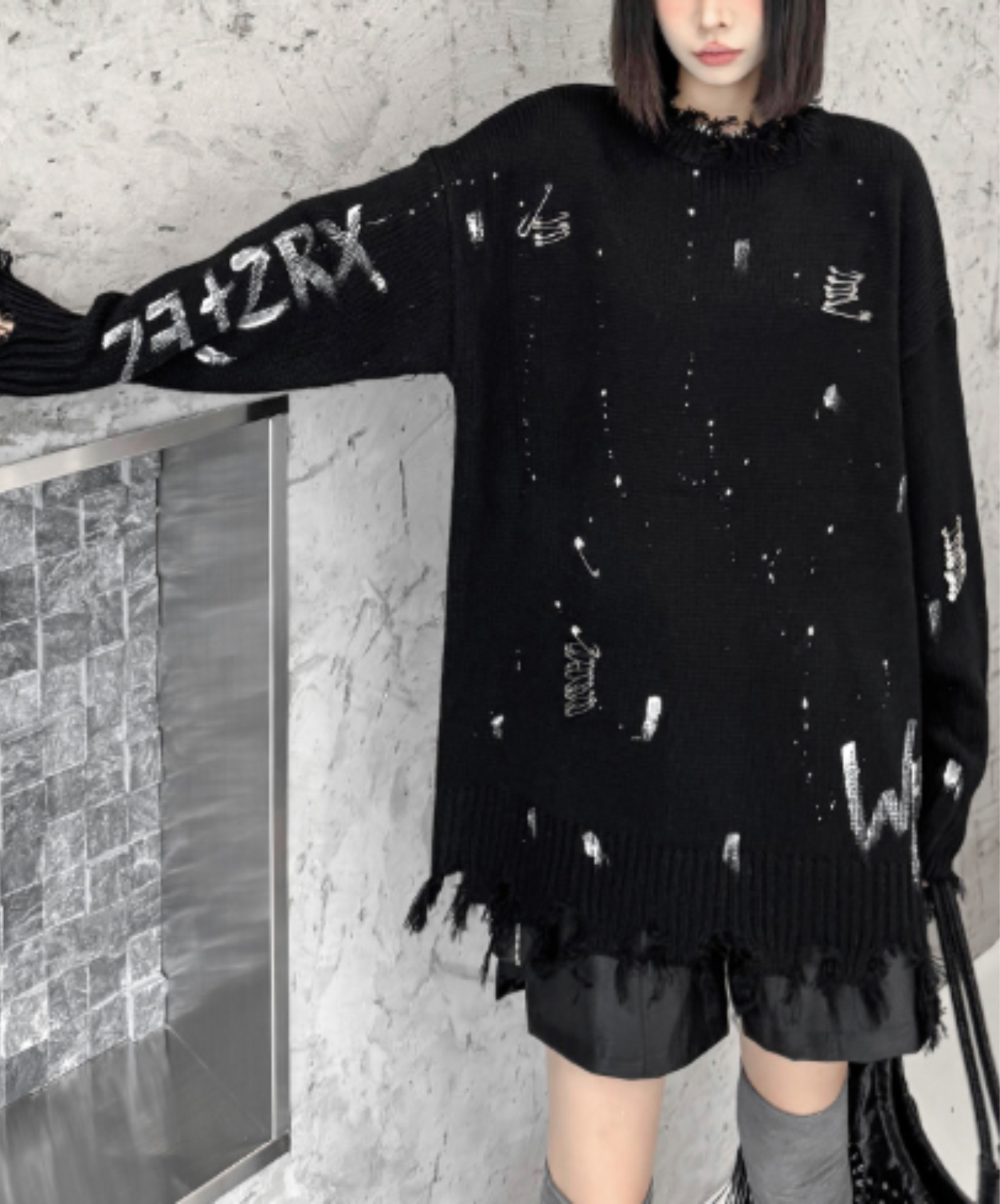 spliced design with heavy distressing sweater EN3124