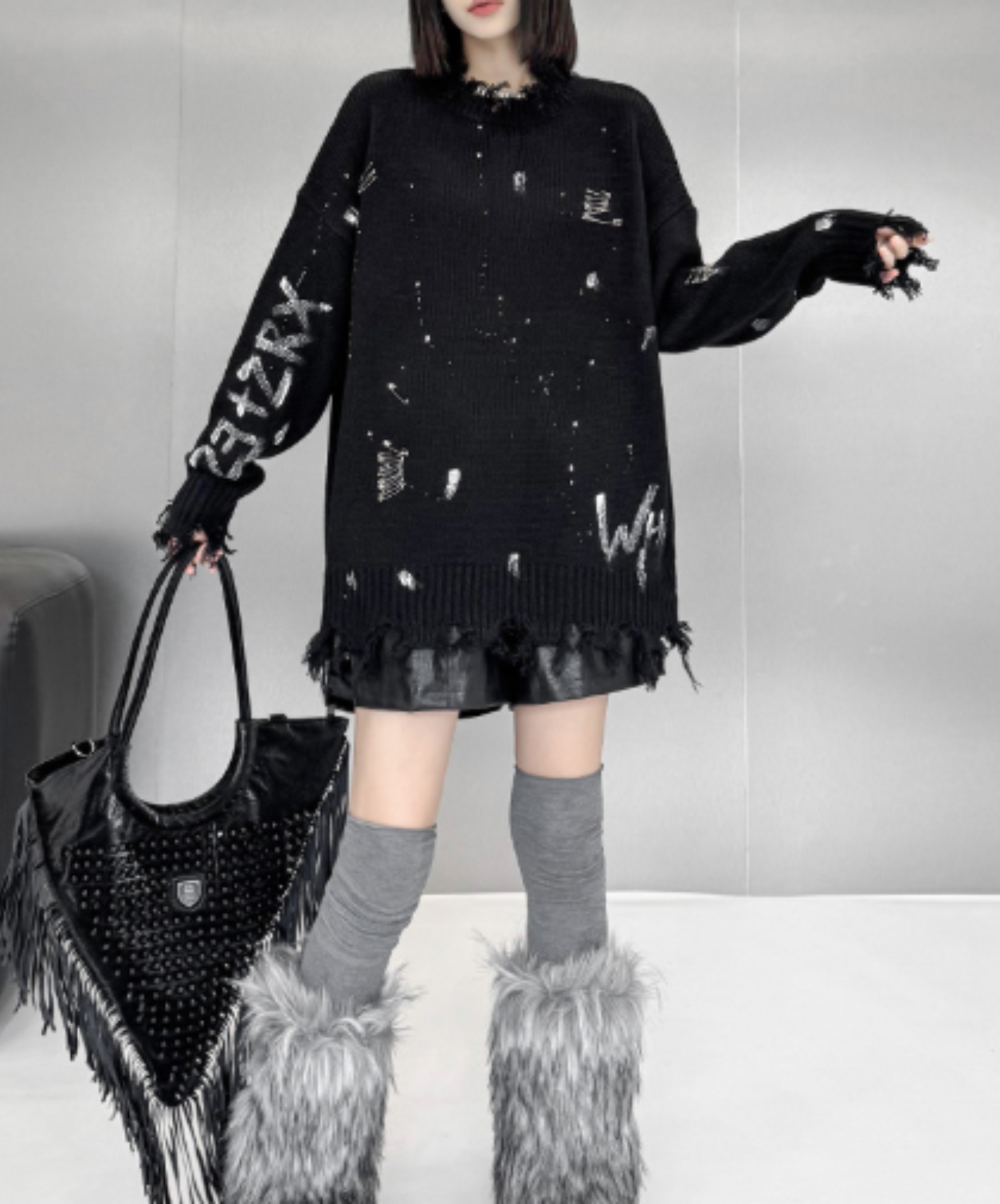 spliced design with heavy distressing sweater EN3124