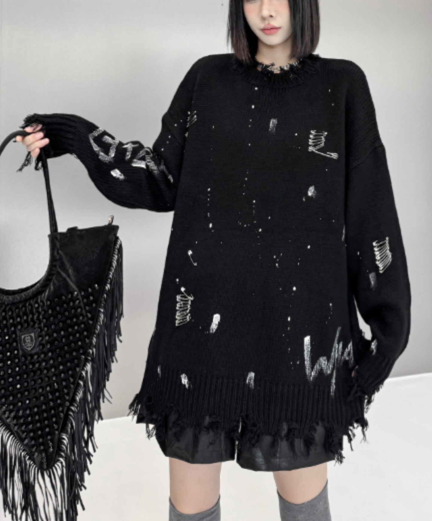 spliced design with heavy distressing sweater EN3124