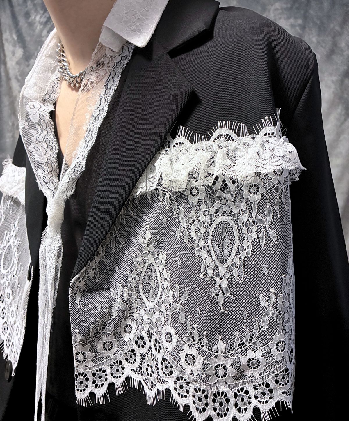 panelled design with a lace bow tie jacket EN3166